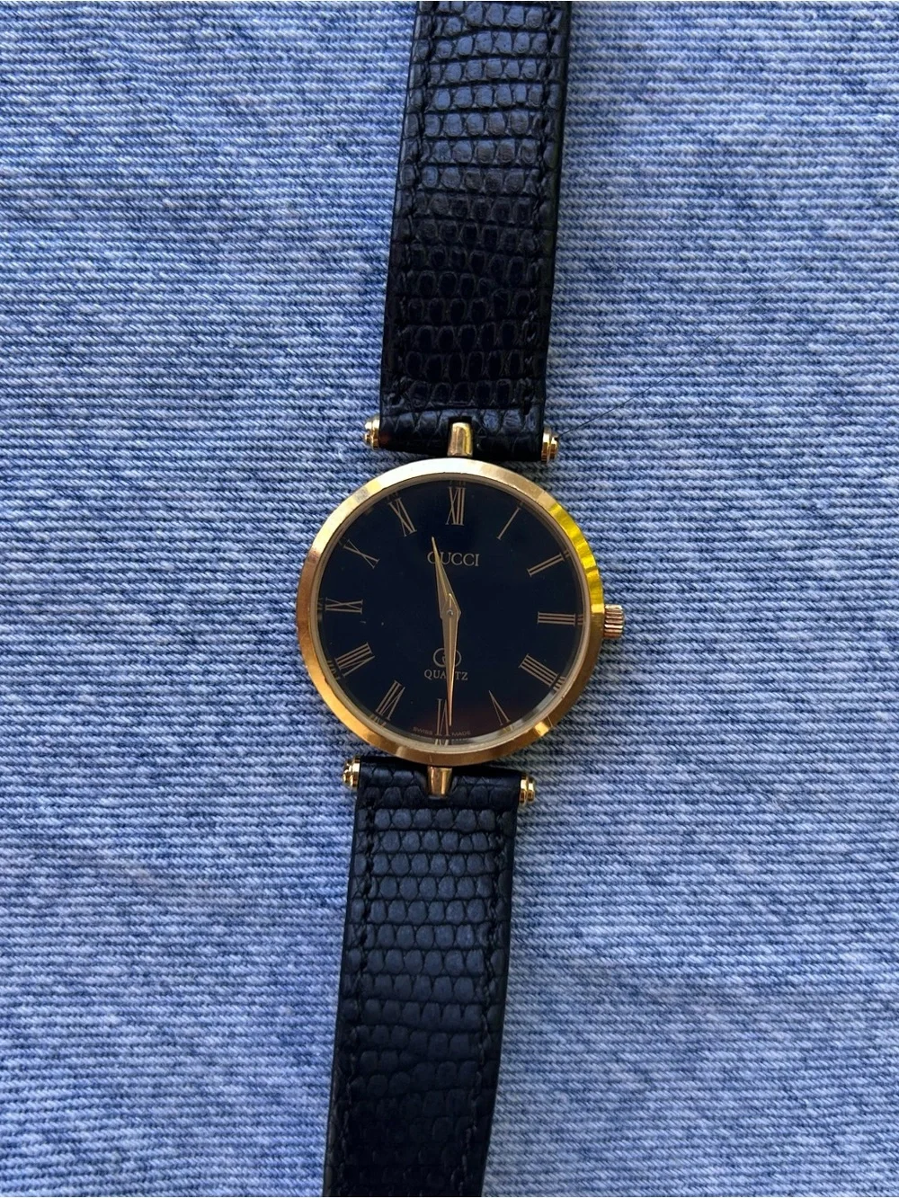 Gucci Black and Gold Round Watch